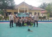 Polsek Kampar Kiri Hilir dan TK Mutiara Bersatu Lestarikan Lingkungan